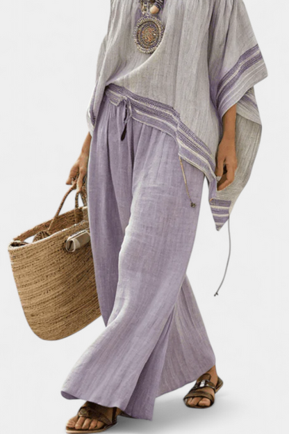Zandrel | Elegante Top Off-Shoulder y Pantalones Rayados de Pierna Ancha