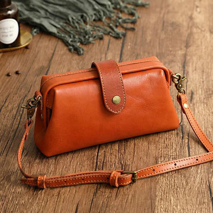 Herdis | Bolsa clásica y compacta en cálido tono cognac