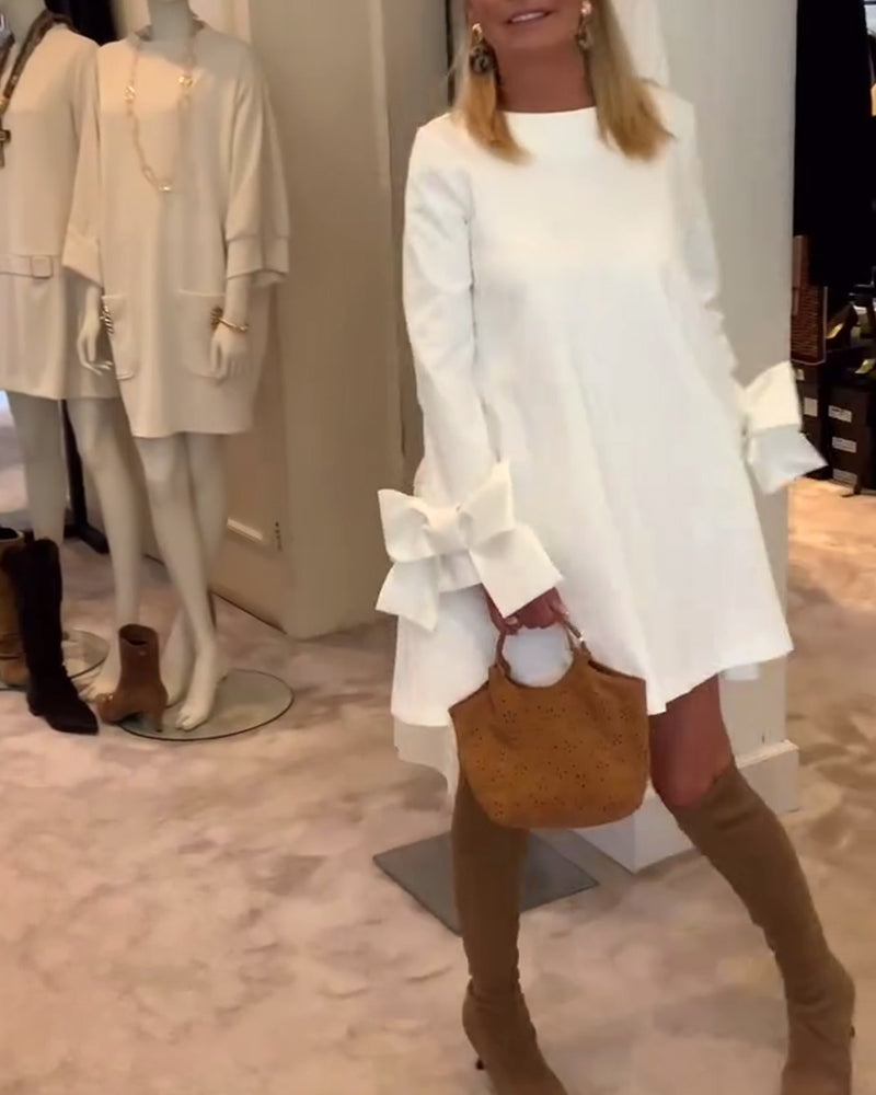 NIA – VESTIDO MINI CON MANGAS DE LAZO ELEGANTE