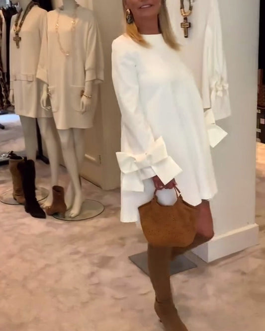 NIA – VESTIDO MINI CON MANGAS DE LAZO ELEGANTE