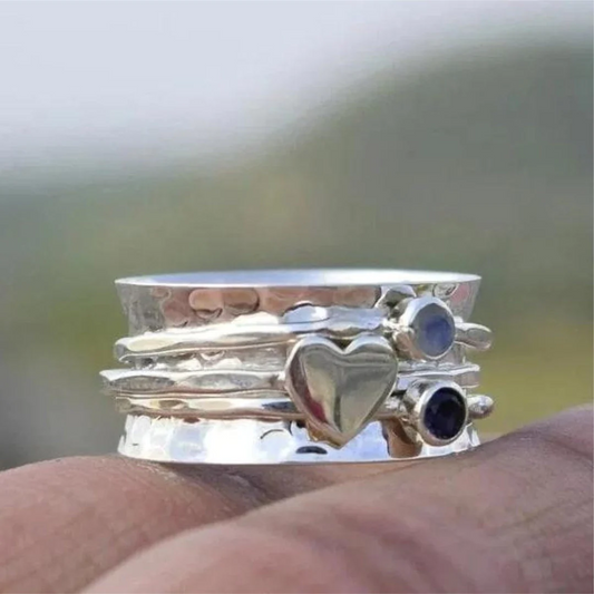 Anillo elegante en forma de corazón giratorio de plata esterlina