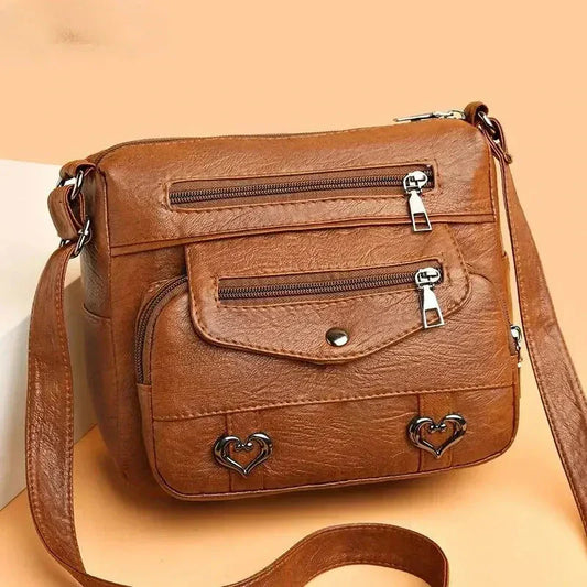 Lux | Bolso cruzado con acento de corazón a la moda